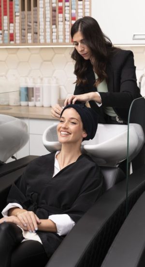 woman-getting-treatment-hairdresser-shop-4-1-683x1024